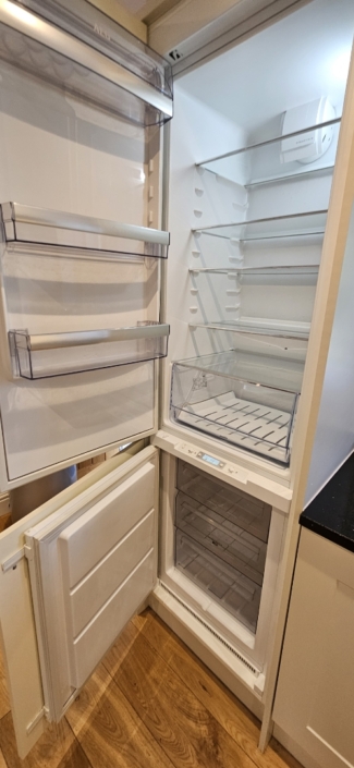 A fridge freezer with open doors